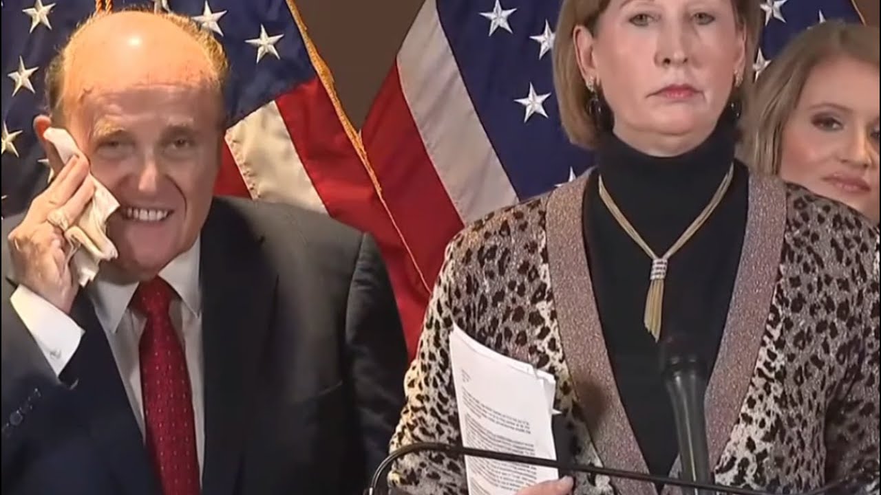 Rudy Giuliani blows his nose and wipes it all over his face. Giuliani booger clip