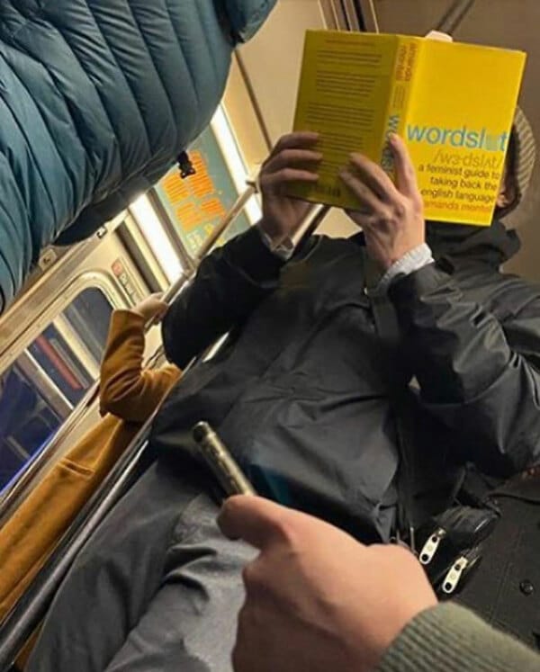 Guy reading book called wordslut on subway.