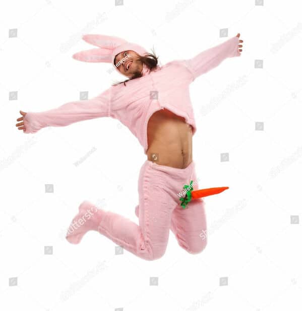 man in a easter bunny outfit and the carrot is his penis