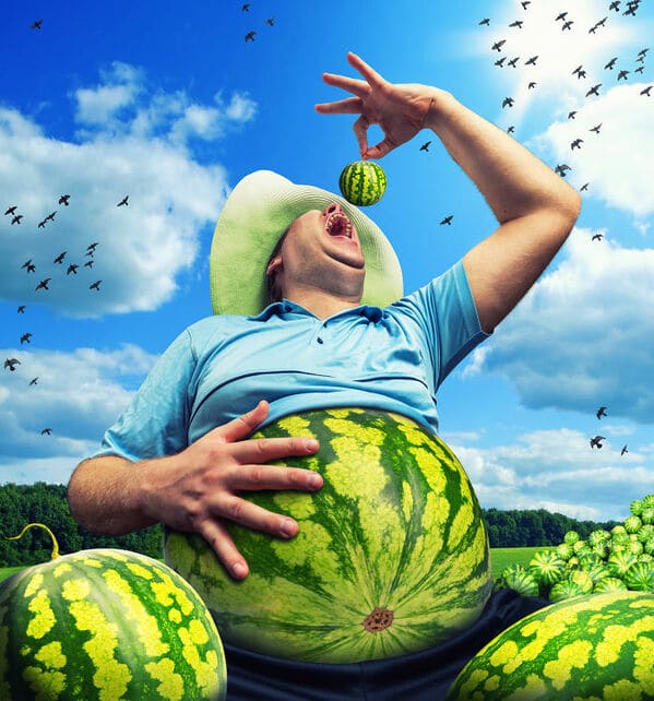 WTF stock photos watermelon stomach and a man eating a whole watermelon