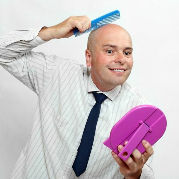 bal man combing skin on head WTF stock photos