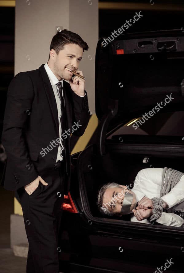 WTF stock photos man in the trunk of a car with duct tape over his mouth