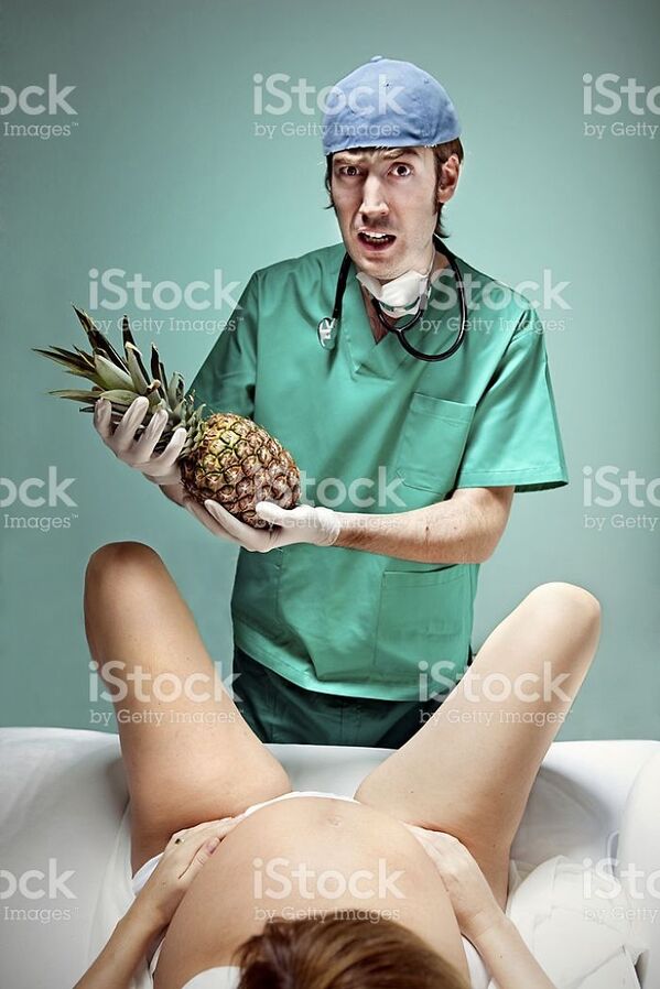 WTF stock photos pineapple baby delivered by doctor in hospital