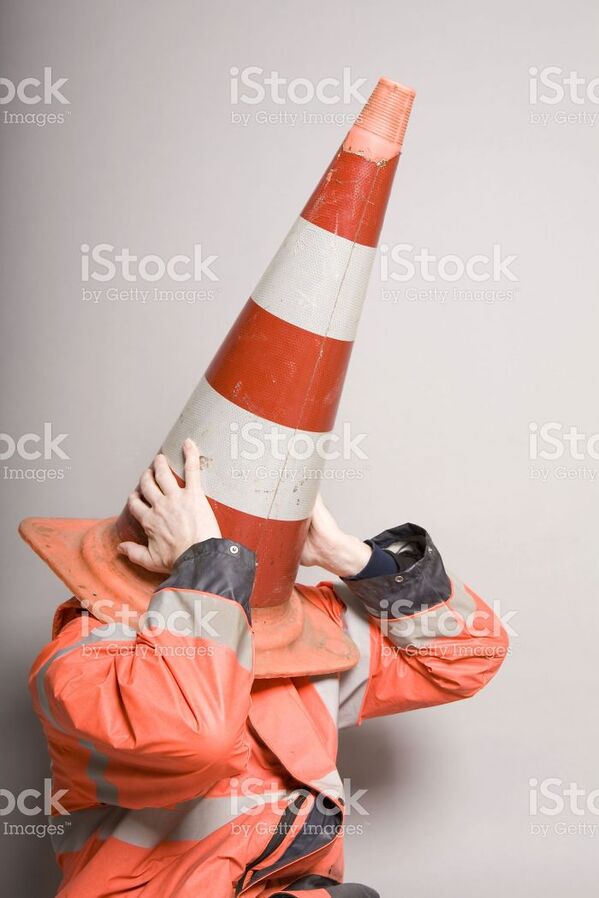 WTF stock photos traffic cone on head