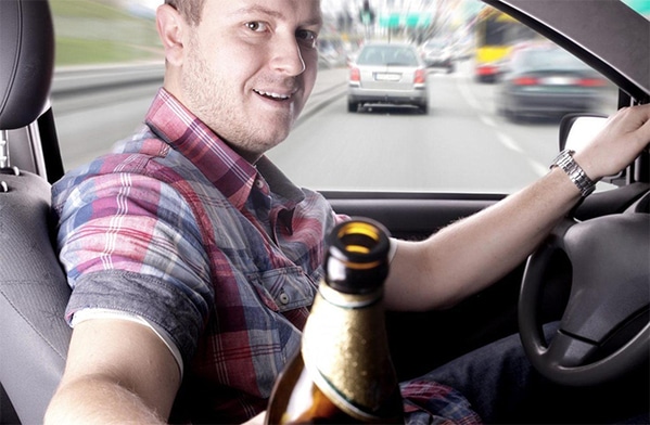 WTF stock photos drunk driver offering beer in car