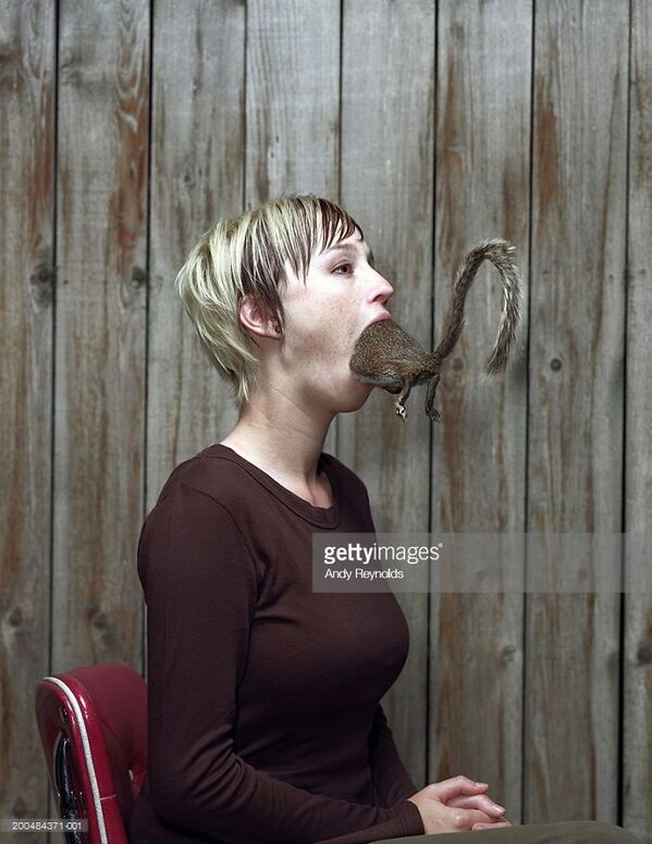 WTF stock photos rat in a woman's mouth