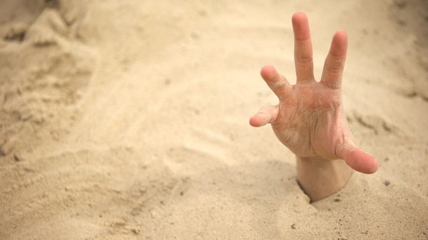 adults share what scared them as kids, scary photos, hand coming out of the sand