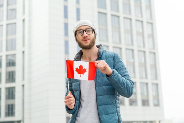 adults share what scared them as kids, scary photos, canadian man holding flag