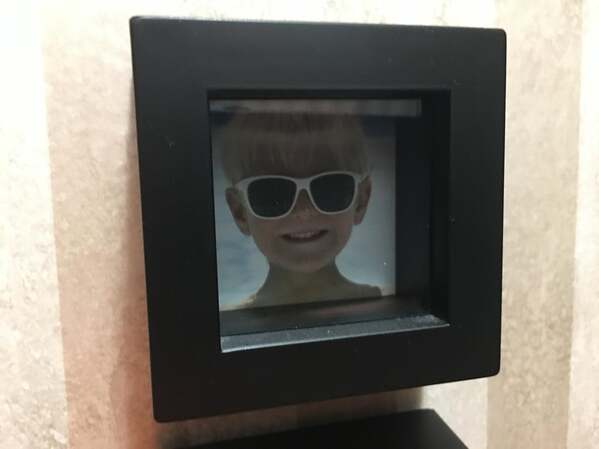 child in picture frame but it's a stock photo that came with the frame, funny people having a worse day, well that sucks