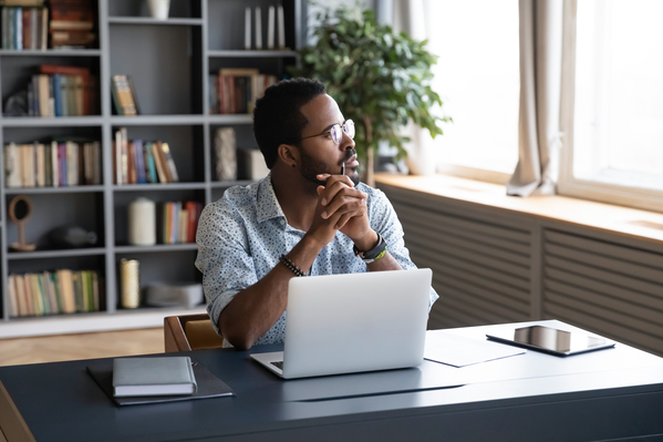 guy at computer looking out window, Banished words in 2021, banned phrases, funny overused words, most overused words of 2020, 2021 canceled words, coronavirus, covid, hated words