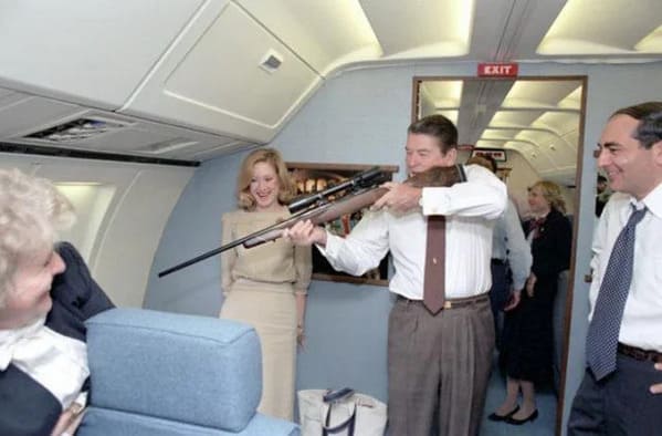 Reagan with a rifle on air force one, Funny Fake history photos, r fakehistoryporn, facts about history that are not true, false textbook photos, historical pics with funny captions, lol, jokes, old photos with hilarious explanations, funny pics