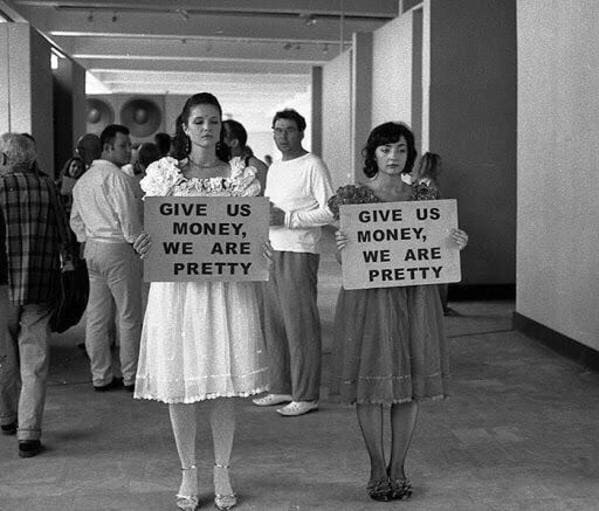 Girls holding signs that say give us money we are pretty, Funny Fake history photos, r fakehistoryporn, facts about history that are not true, false textbook photos, historical pics with funny captions, lol, jokes, old photos with hilarious explanations, funny pics