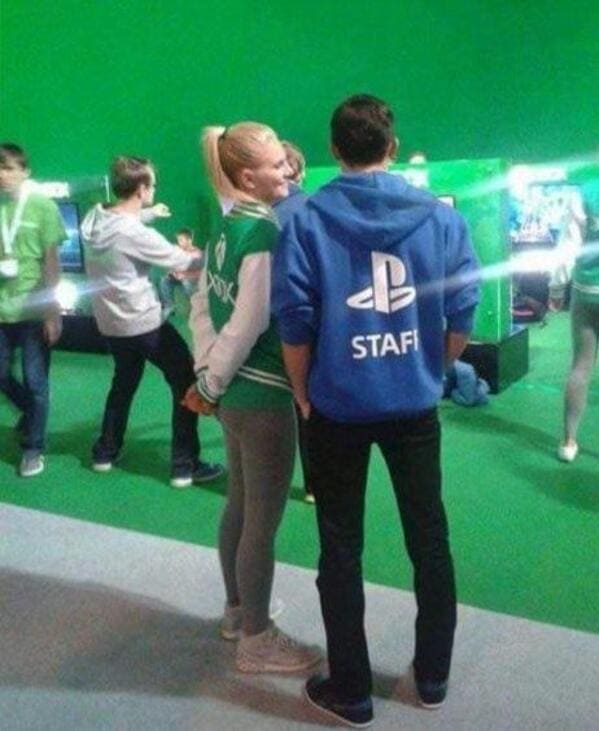 Guy and girl talking to each other and the guy has a playstation shirt and the girl has an xbox shirt, Funny Fake history photos, r fakehistoryporn, facts about history that are not true, false textbook photos, historical pics with funny captions, lol, jokes, old photos with hilarious explanations, funny pics