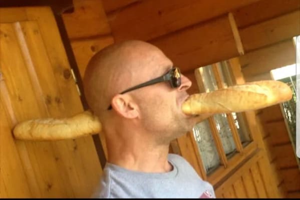 Man in sunglasses with baguette sticking out of both sides of head, Funny Fake history photos, r fakehistoryporn, facts about history that are not true, false textbook photos, historical pics with funny captions, lol, jokes, old photos with hilarious explanations, funny pics