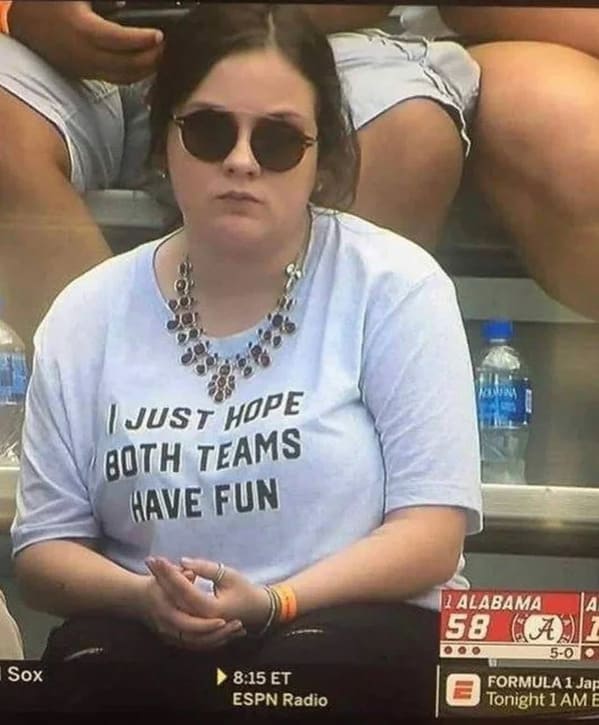 sad girl at sporting event with shirt saying I just hope both teams have fun, Funny Fake history photos, r fakehistoryporn, facts about history that are not true, false textbook photos, historical pics with funny captions, lol, jokes, old photos with hilarious explanations, funny pics