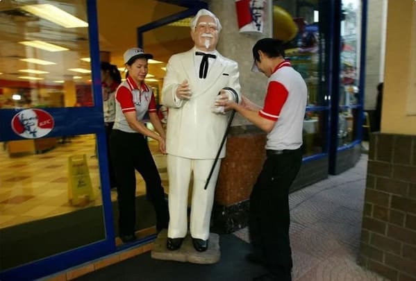 KFC colonel statue being moved outside the restaurant, Funny Fake history photos, r fakehistoryporn, facts about history that are not true, false textbook photos, historical pics with funny captions, lol, jokes, old photos with hilarious explanations, funny pics