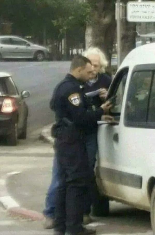 Man with white hair arguing with cop over ticket, Funny Fake history photos, r fakehistoryporn, facts about history that are not true, false textbook photos, historical pics with funny captions, lol, jokes, old photos with hilarious explanations, funny pics