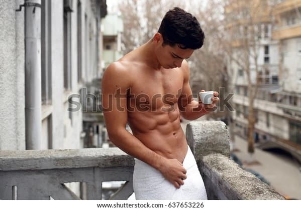 hot dude with abs drinking coffee on a balcony in a city, Sexy stock photos twitter, funny wtf stock photos, innocent searches that led to weirdly sexualized stock photos, hot sexy men and women of shutterstock, Getty, hornystockphoto, twitter